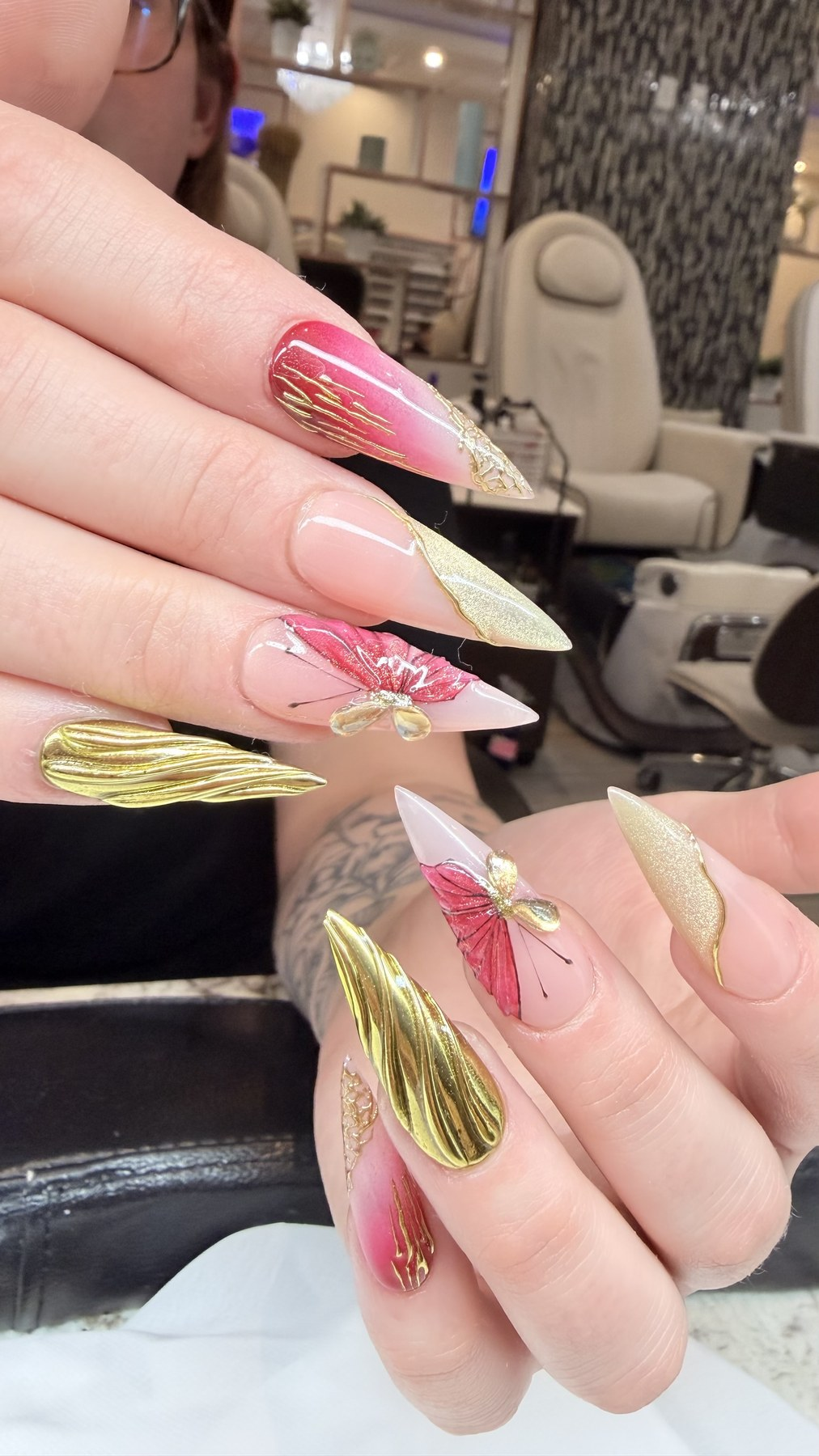 Pink and gold butterfly nail art